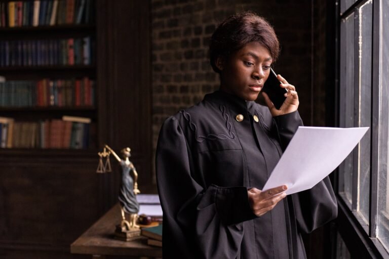 A judge deeply engrossed in reading legal documents.